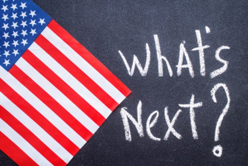 What's next on the chalk board and US flag. Election concept